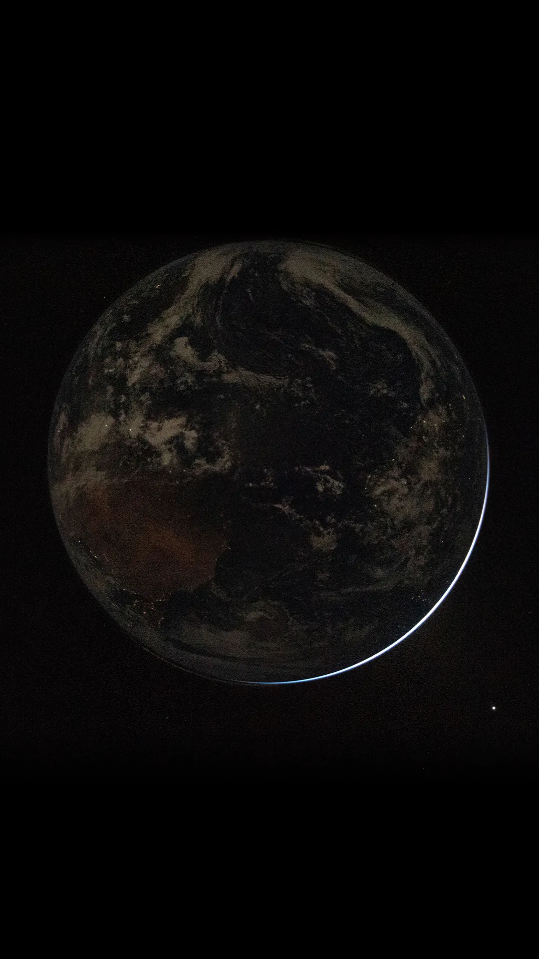 Artemis II Backlit Earth Mobile Wallpaper - NASA